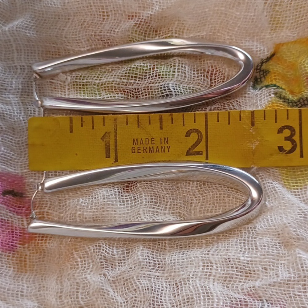 Italian 14k wg elongated hoops.